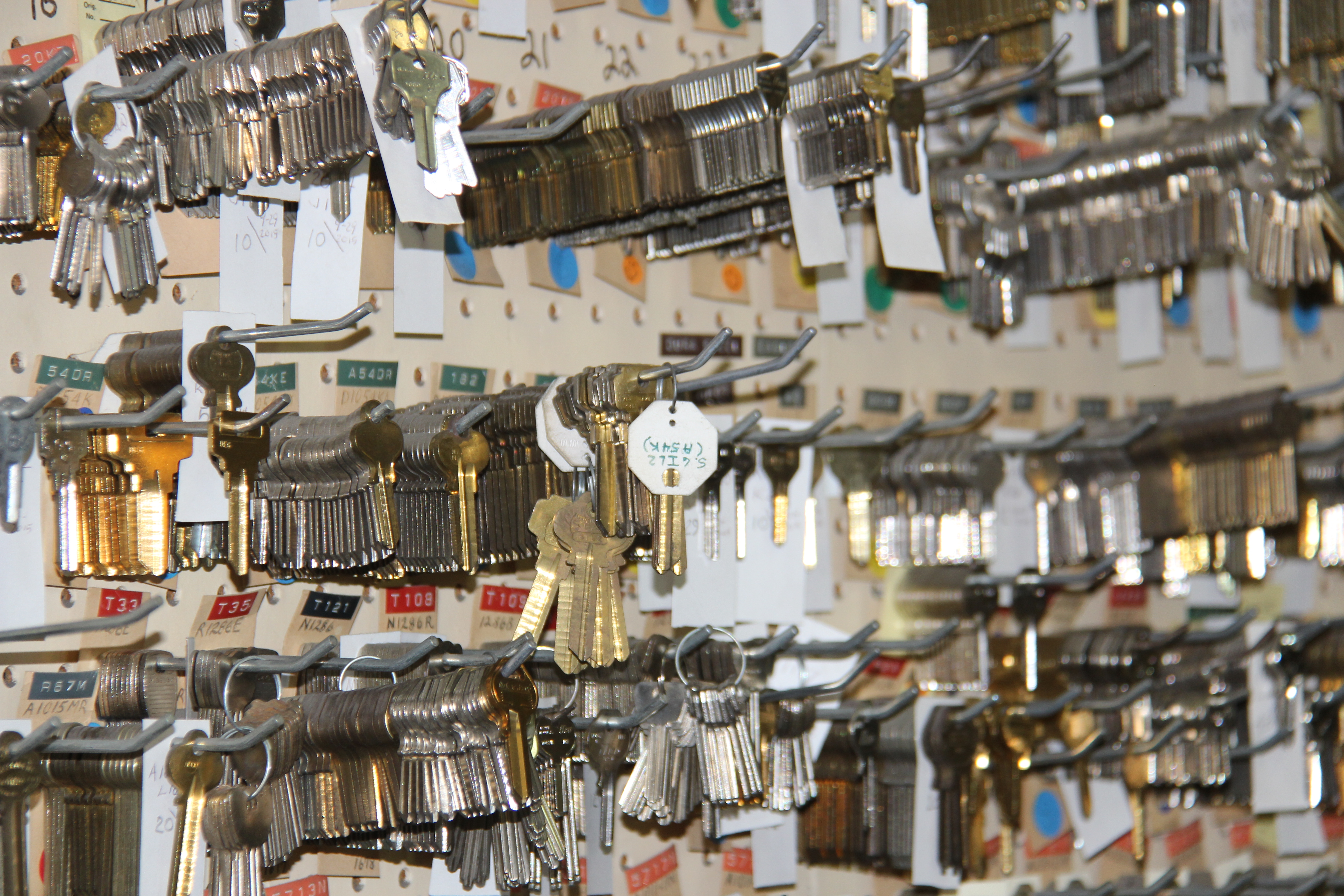 Photo of key blanks hanging on a wall of keys